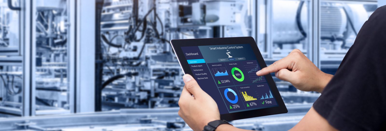 Hands holding tablet on blurred automation machine as background